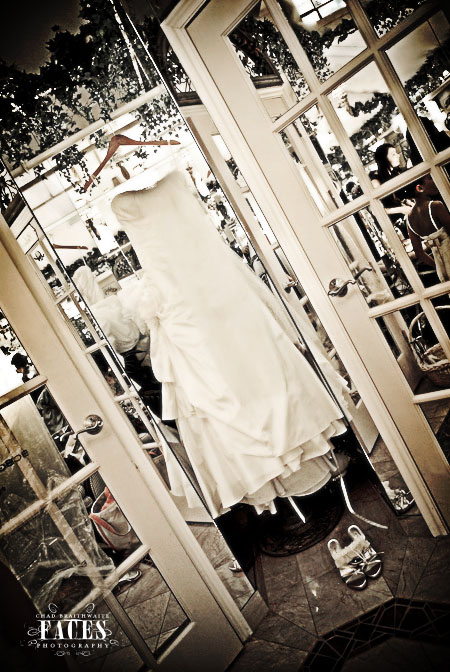 Wedding dress and shoes hanging up