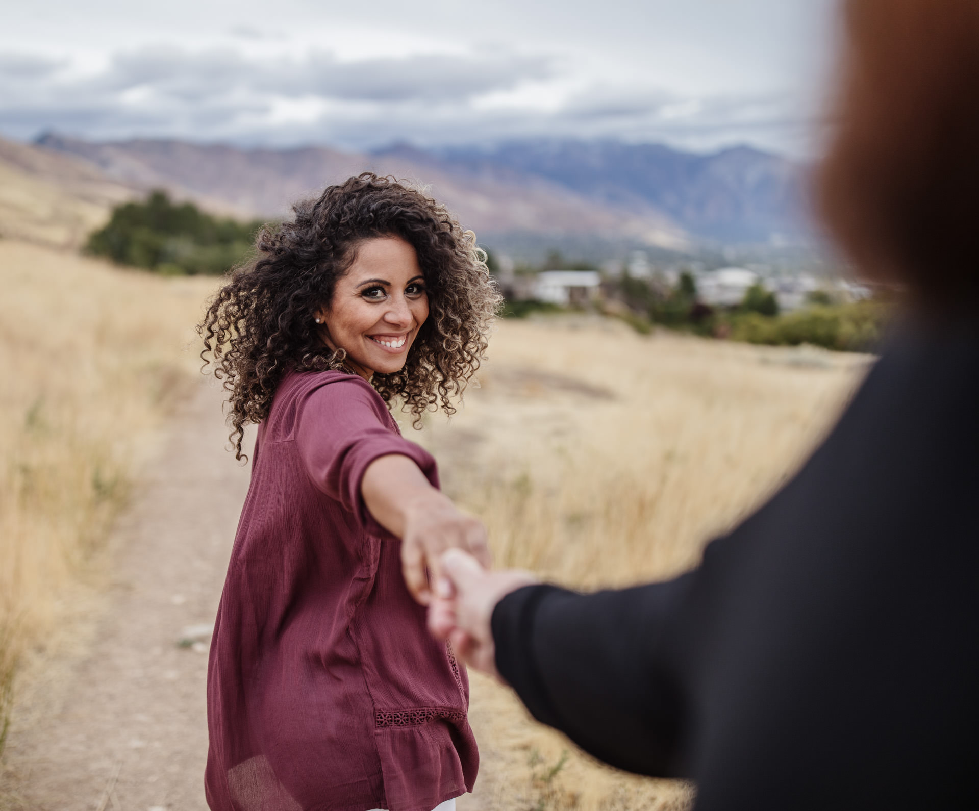 Gerusa leads Eric down the Bonneville Shoreline Trail during engagement session