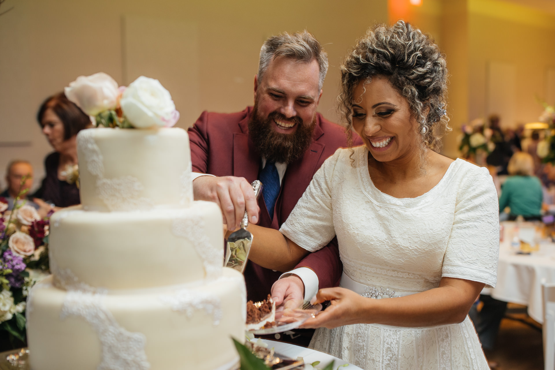 Gerusa Eric The Falls Reception Center cutting the cake