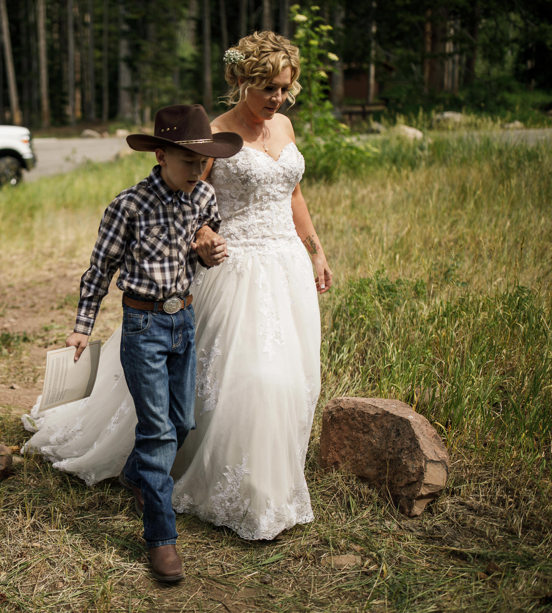 Dog walks bride down the aisle Faces Photography