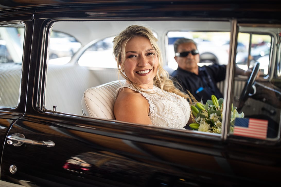 Bride driving to ceremony in a Belair