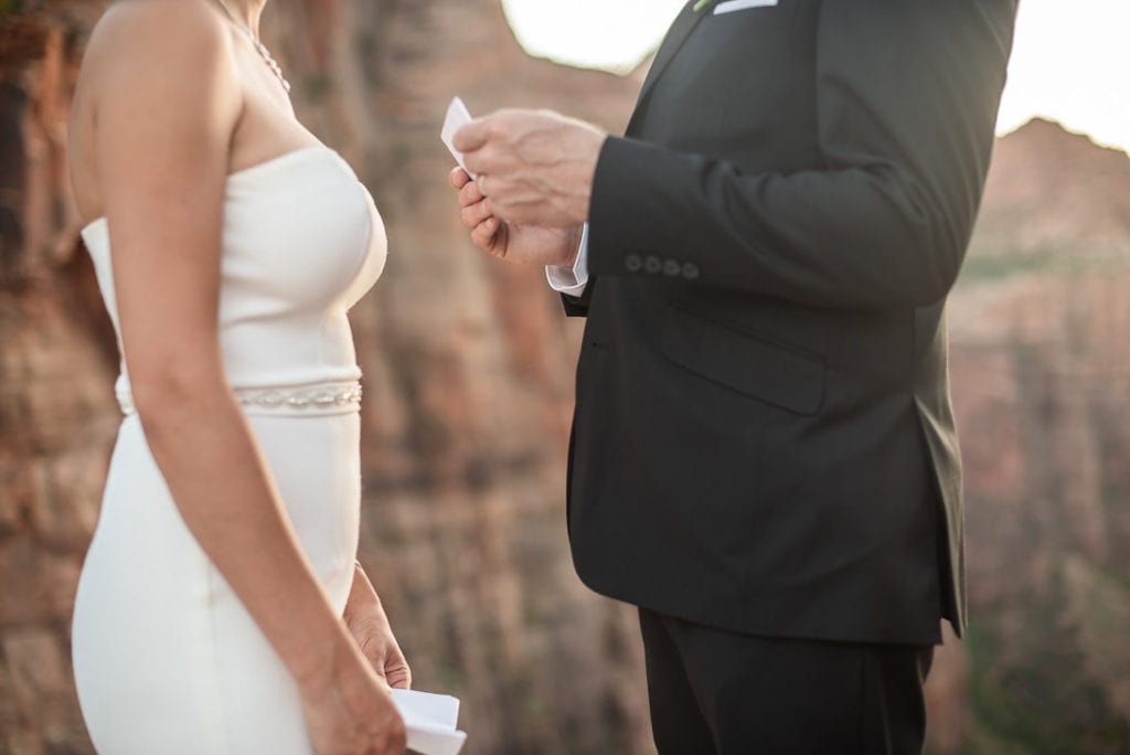 Zion Nation Park Elopement Exchanging Vow on Canyon Overlook