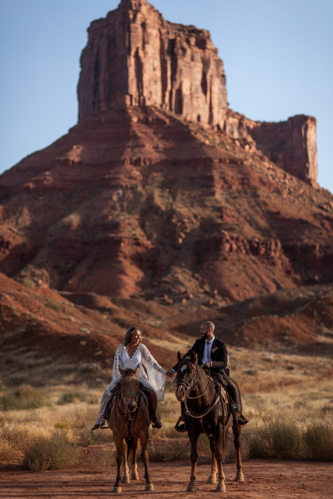 Moab Wedding Elopement Horseback Riding during their moab eleopement