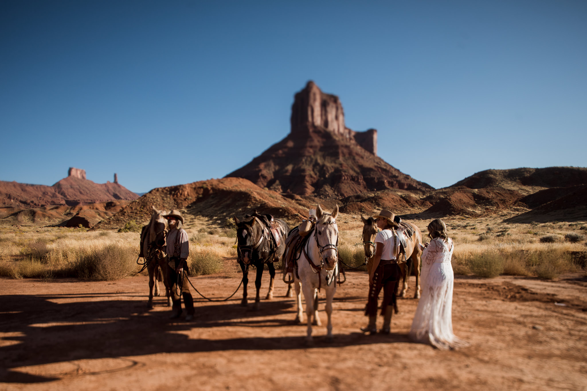 Bride and Groom Horseback Ride near Castleton Tower