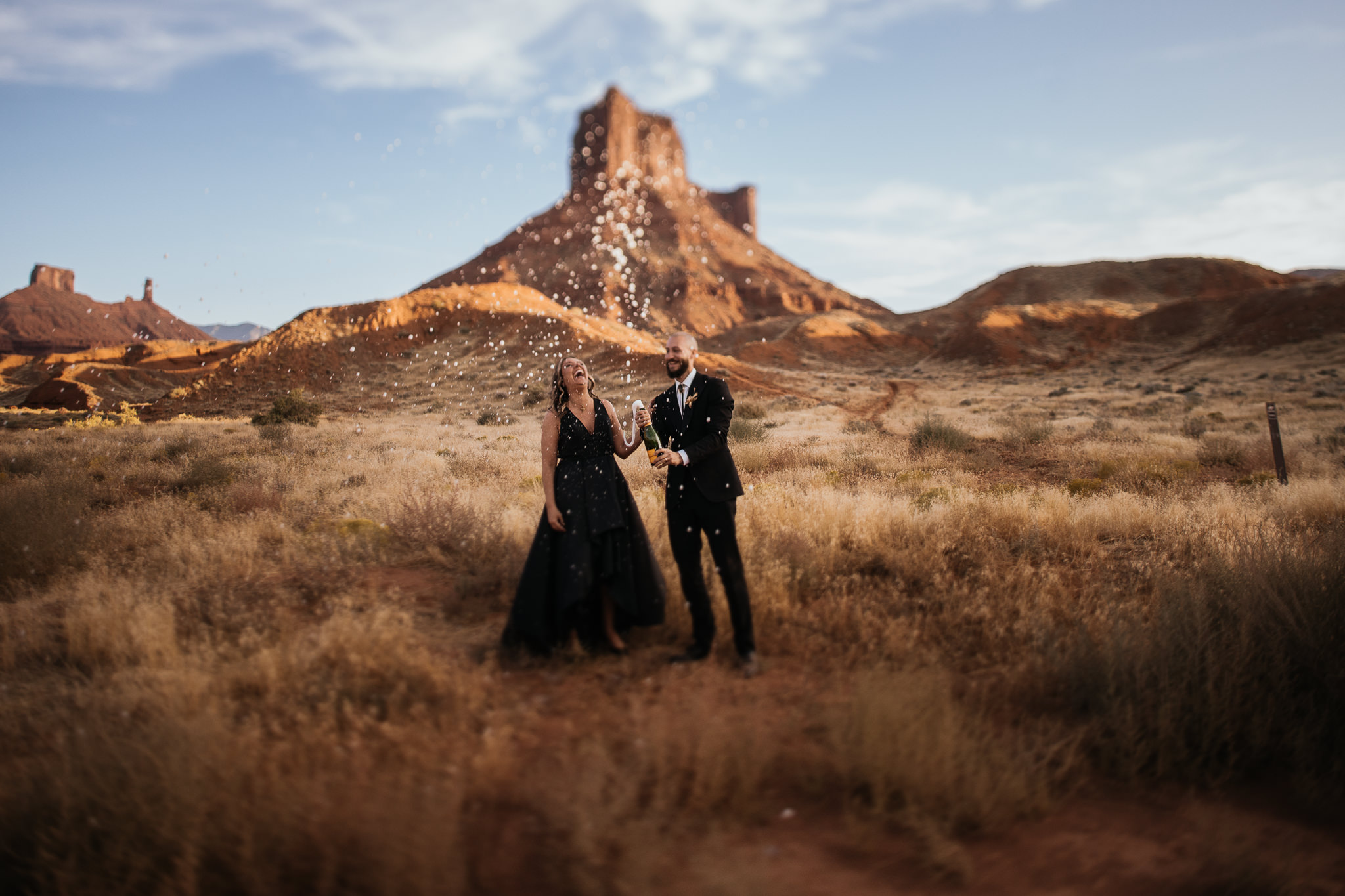 Bride and Groom Celebrate their Moab Elopement with Champagne Toast