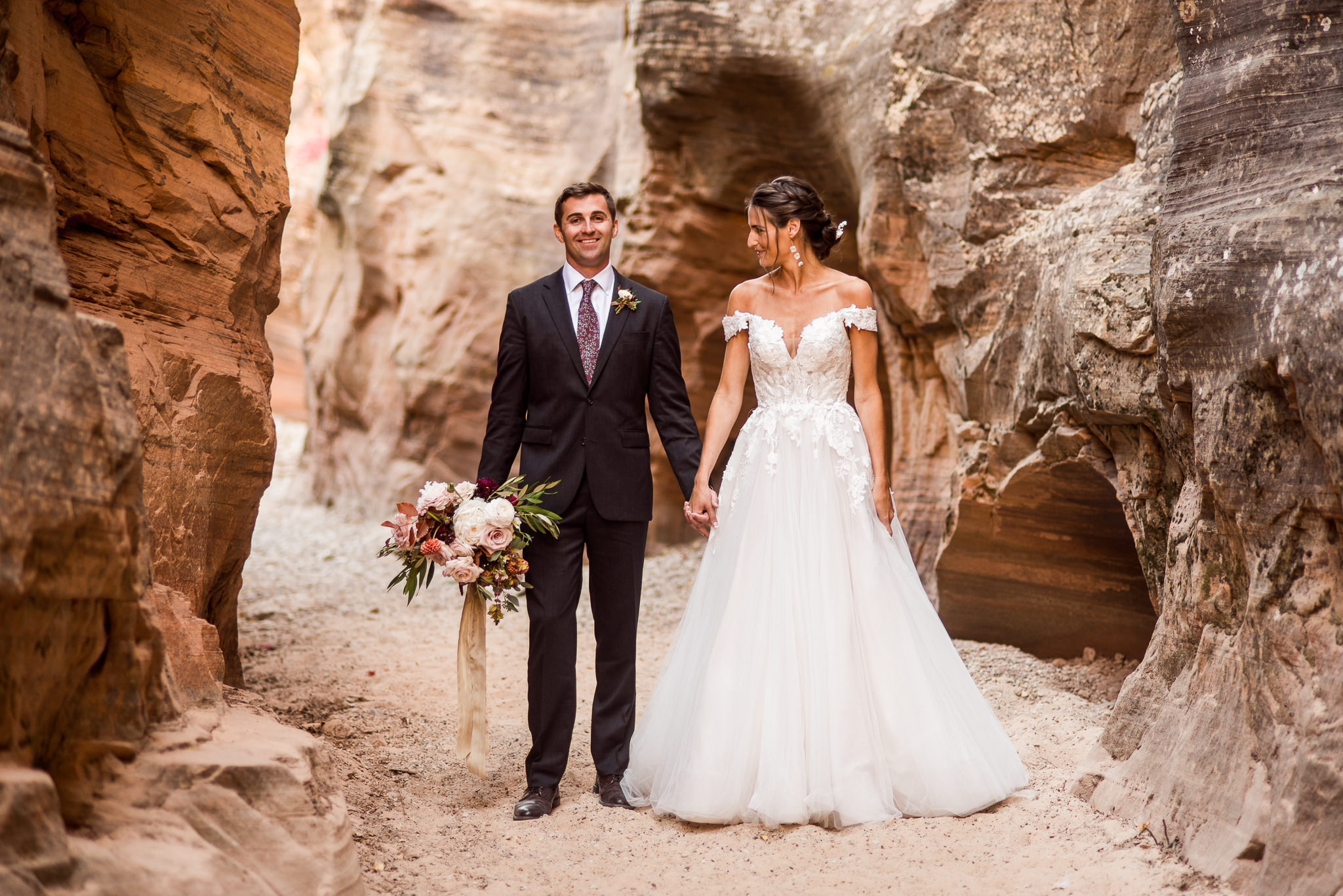 Bride and Groom take Portraits in a slot Canyon