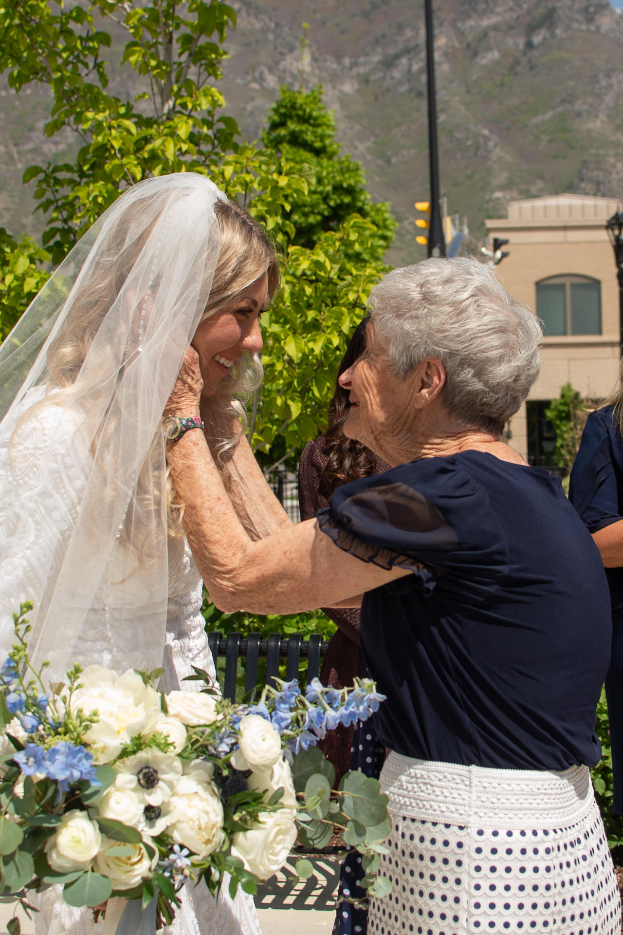 Bride and Groom Greet Guests Outside Temple