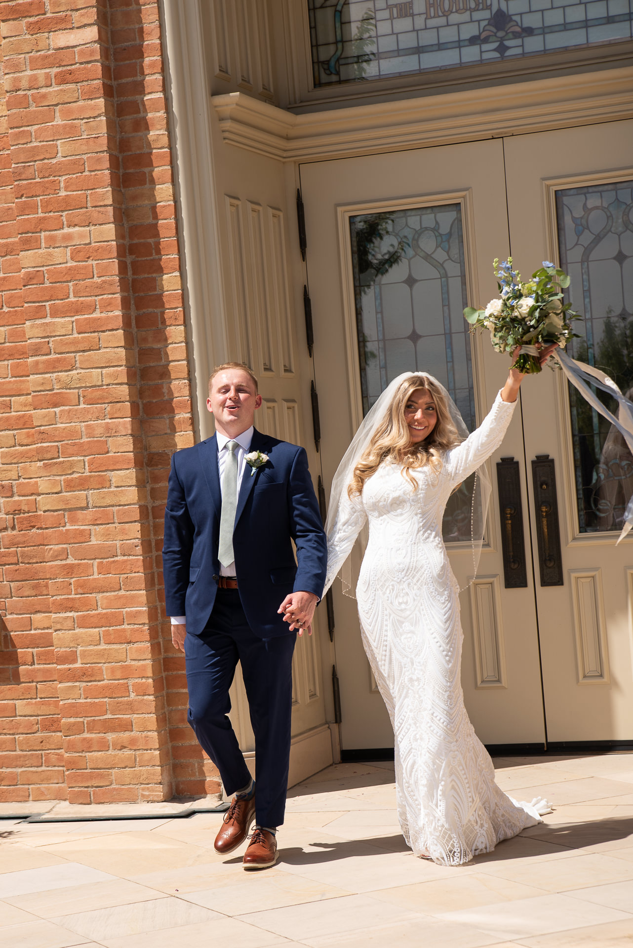 Bride and Groom Greet Guests Outside Temple