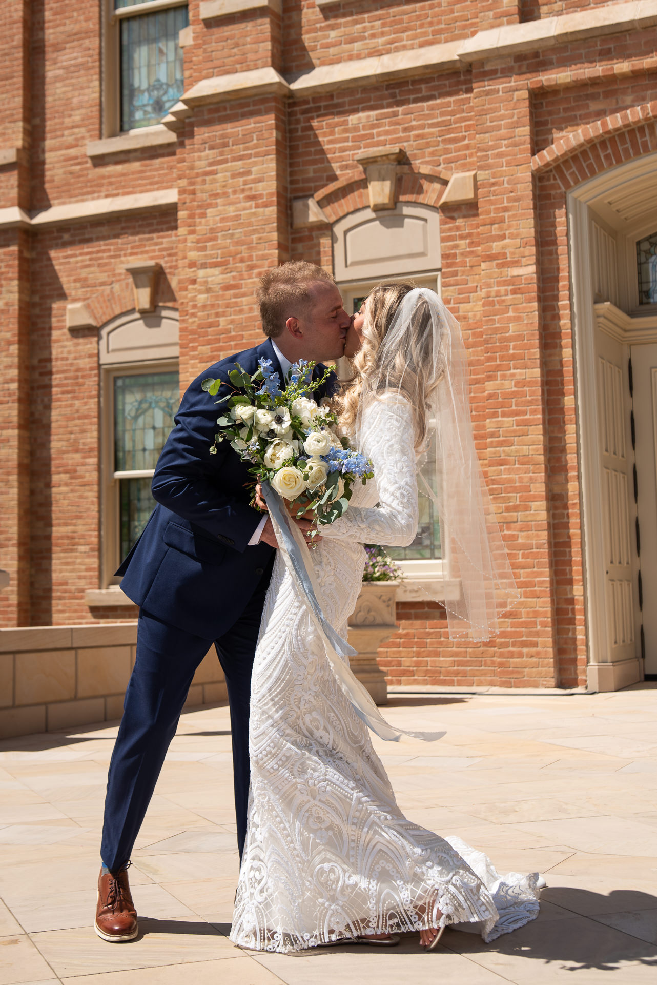 Bride and Groom Greet Guests Outside Temple