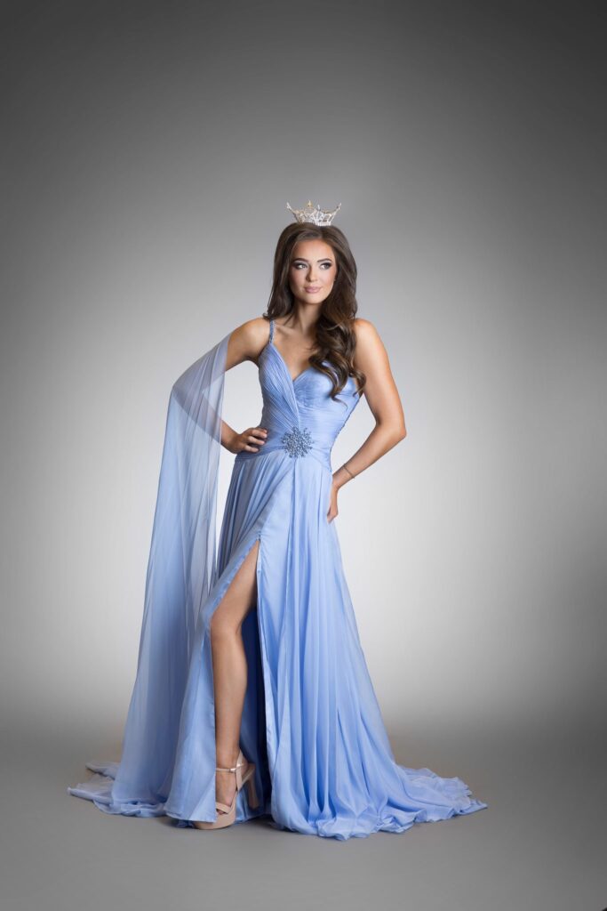 Full-length studio portrait of Elle Anderson, Miss Utah's Teen 2026, in a blue gown and crown